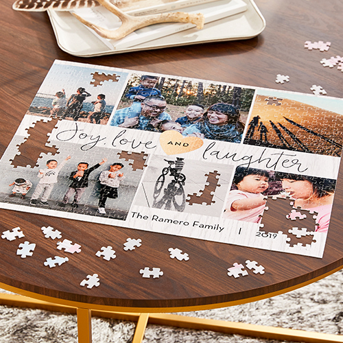photo puzzle on wood table with pieces scattered
