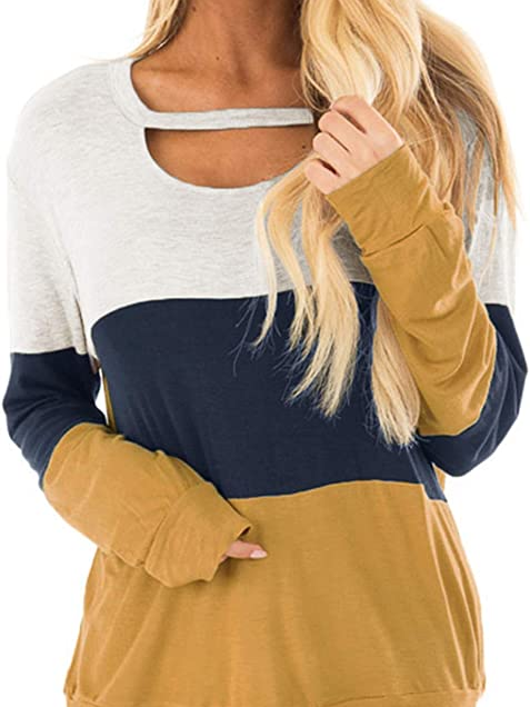 woman wearing white, nave, and yellow color block sweater