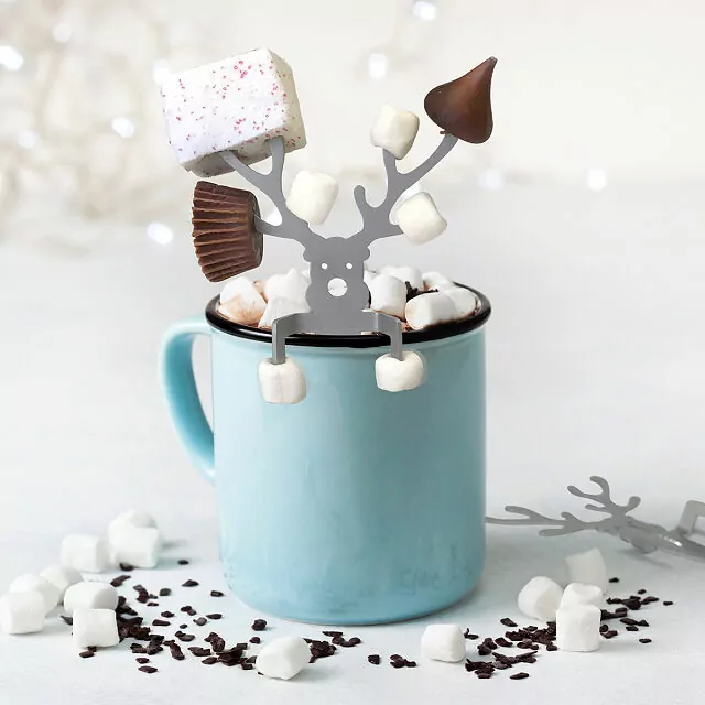 teal mug with silver reindeer with chocolate and marshmallows on antlers