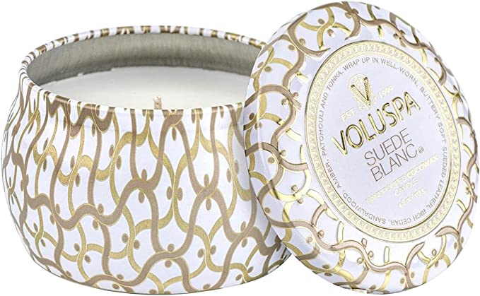 gold and white candle with lid