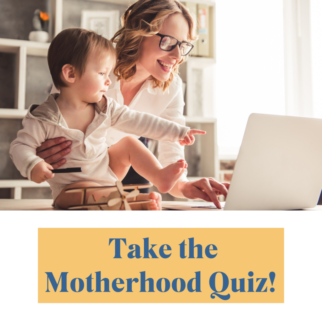 Happy mom smiling with toddler son pointing at a laptop as she takes the motherhood quiz.