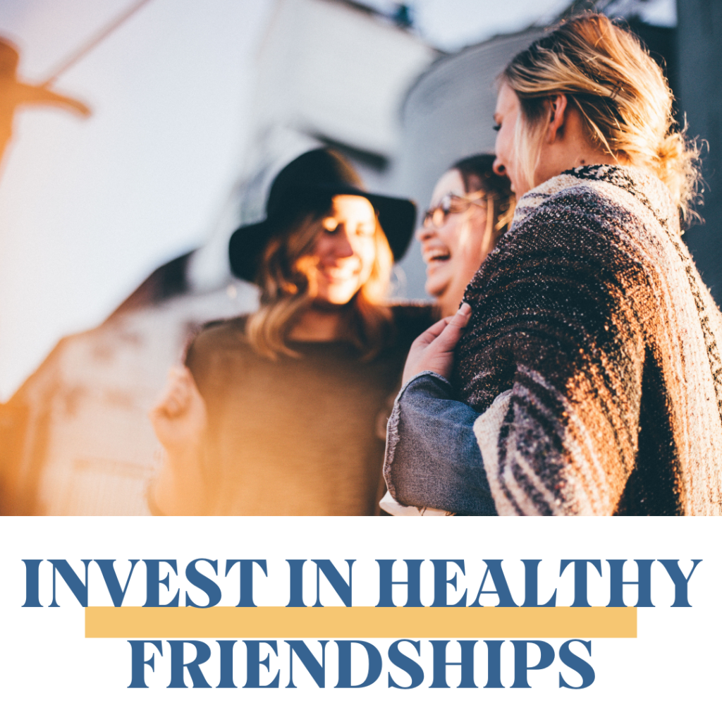 Three smiling women investing in healthy friendships.