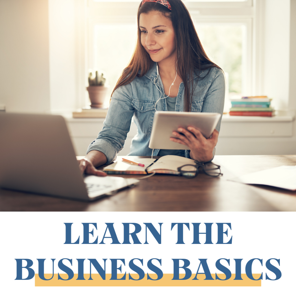 Women at her laptop with a notebook learning the business basics of becoming a coach